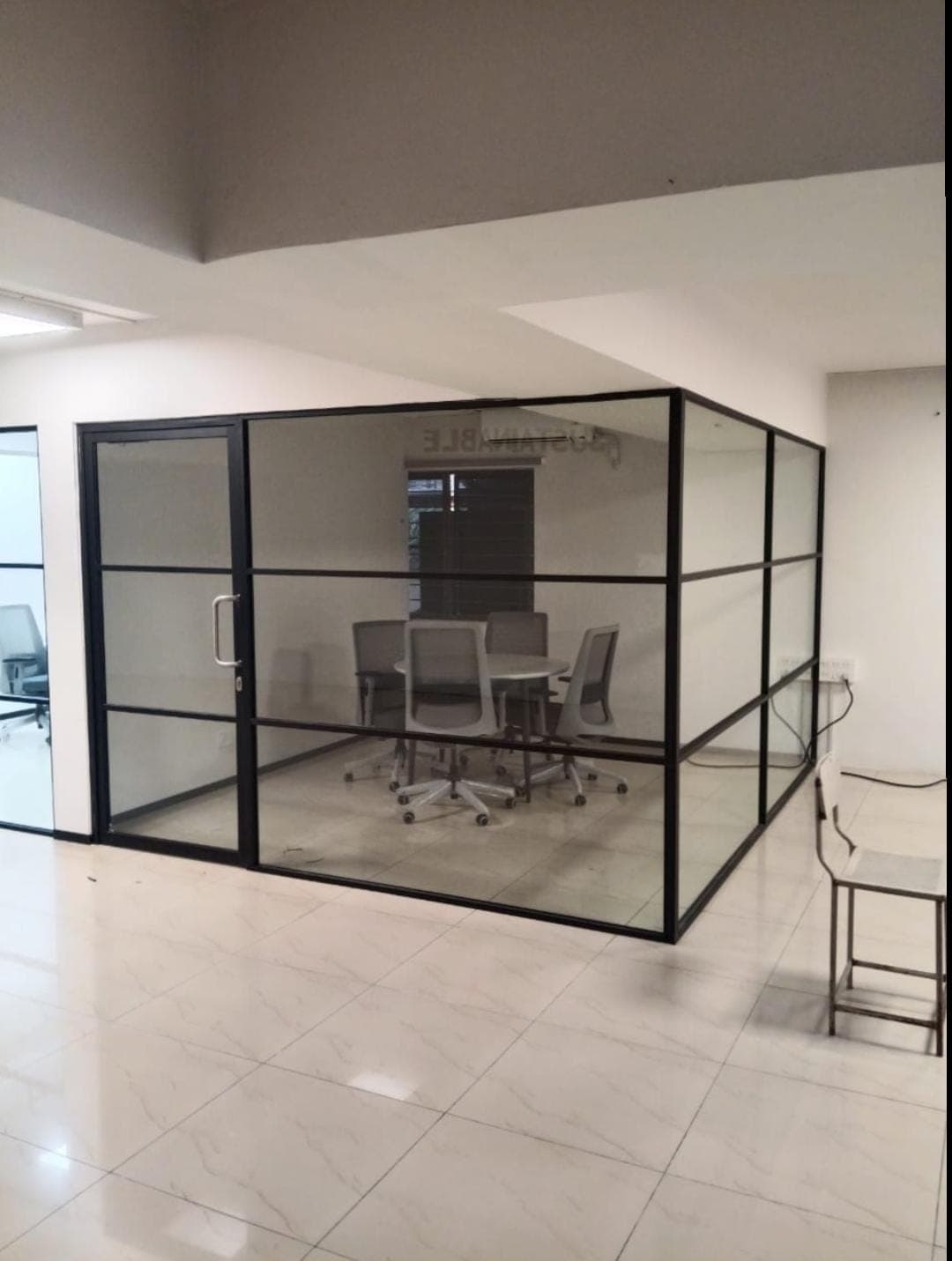 Frameless glass office partition fitted in a Bengaluru workspace