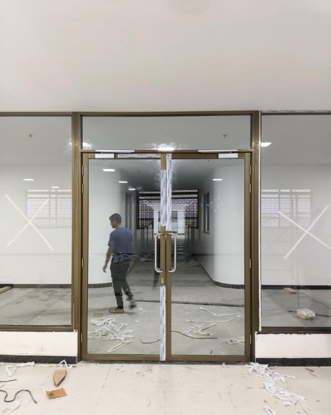 Floor-to-ceiling frameless glass office wall