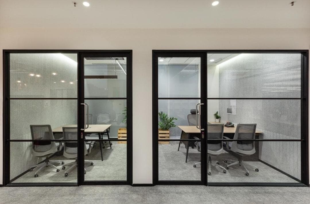 Frameless glass office partition fitted in a Bengaluru workspace