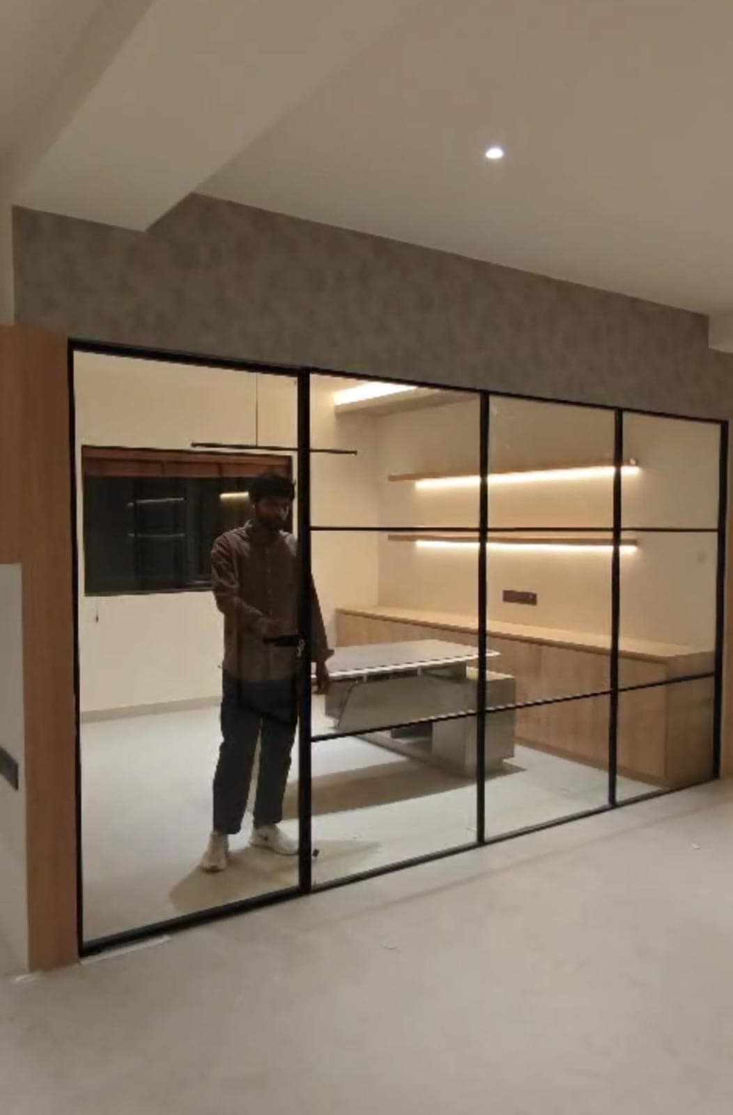 Floor-to-ceiling frameless glass office wall