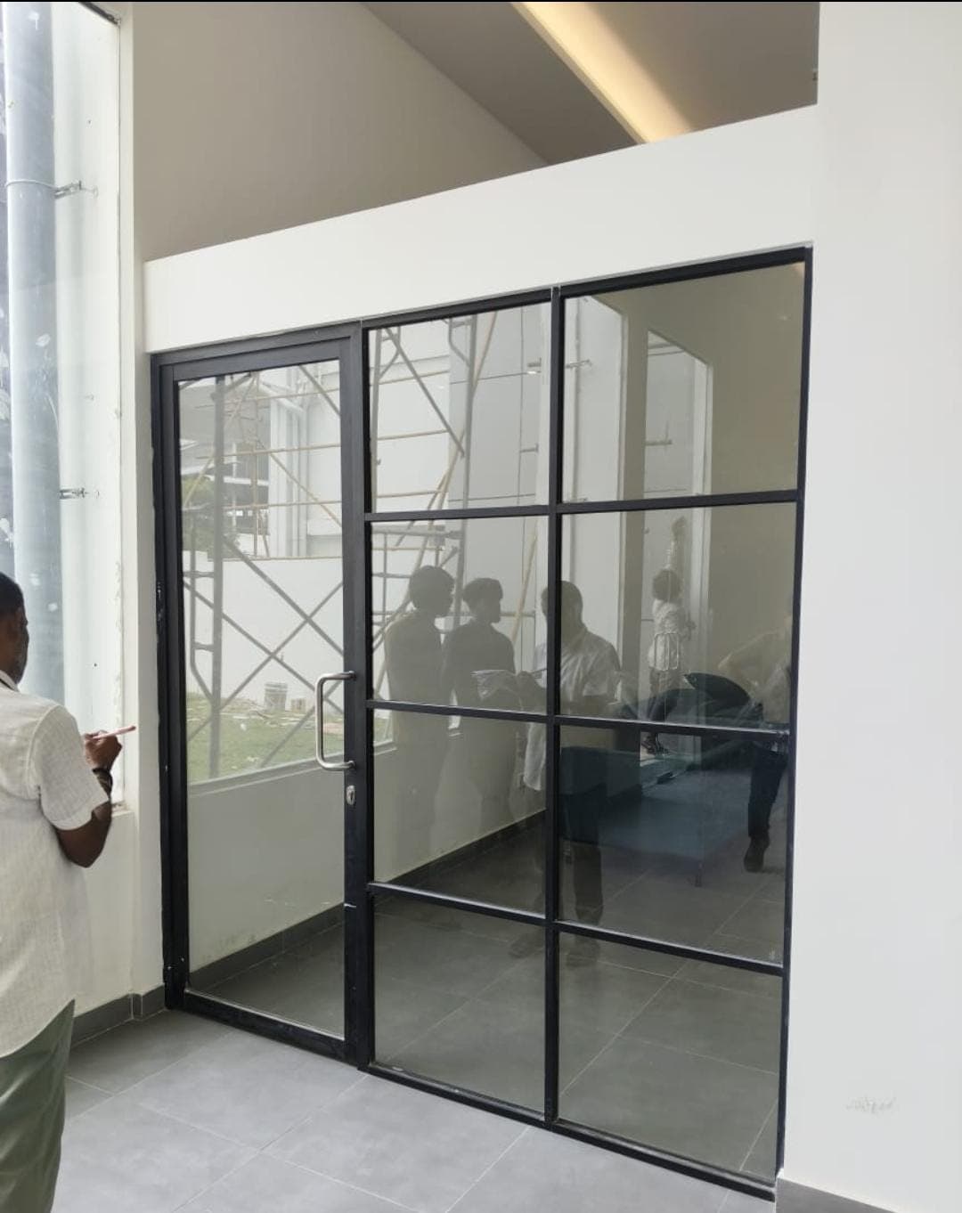Toughened glass partition for a private office cabin
