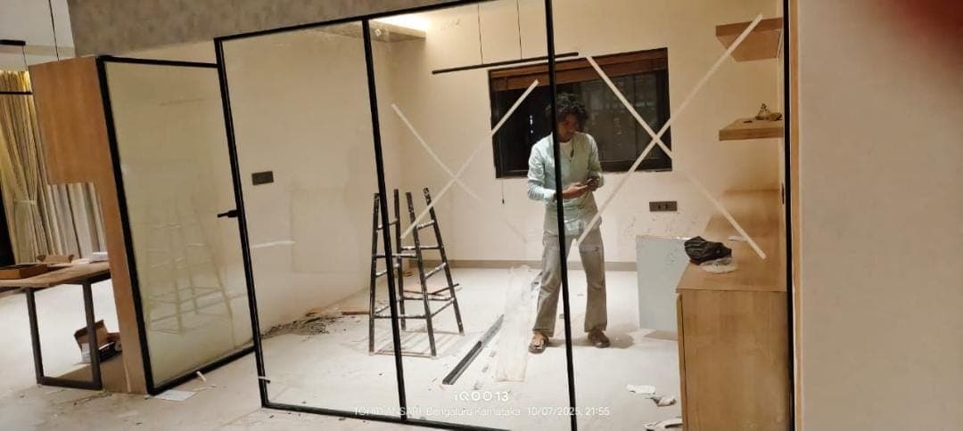 Toughened glass partition for a private office cabin