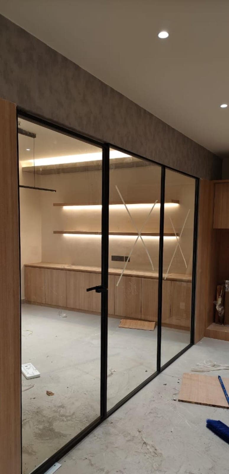 Frameless glass office partition fitted in a Bengaluru workspace