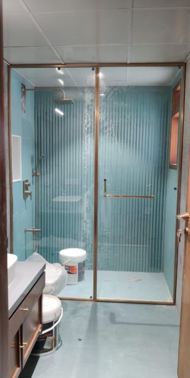 Frameless glass shower cubicle fitted in a Bengaluru bathroom