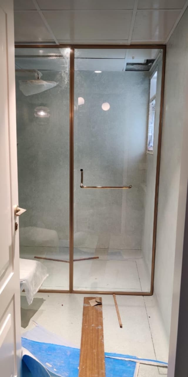 Corner glass shower enclosure fitted by Fabrockers in Bengaluru